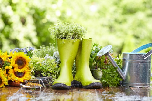 Experienced gardener trimming hedges in Gunnersbury